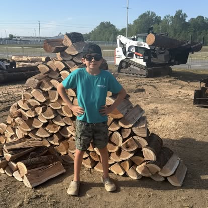 Log pile with Ridge Halverson Wood Products